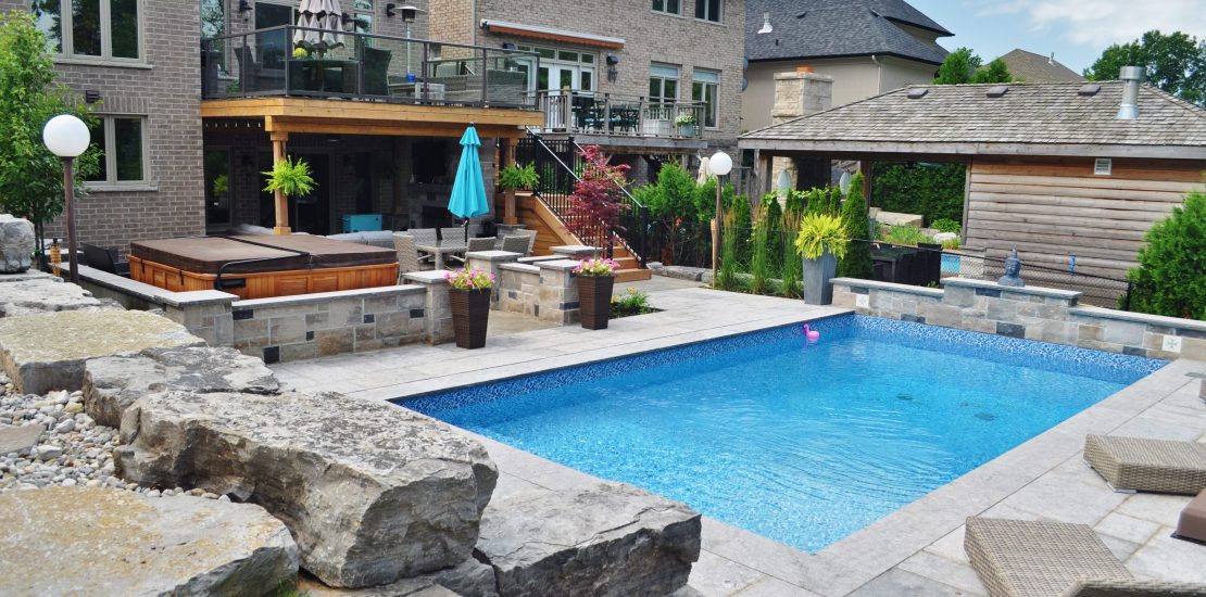 Pool, hot tub, stone retaining wall, privacy screen, upper deck