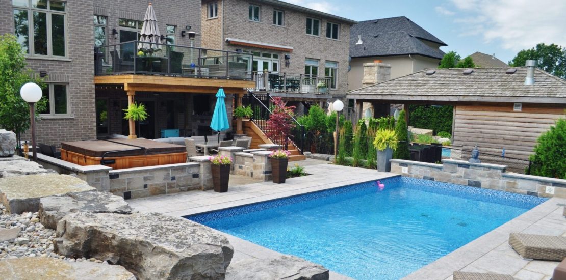 Pool, hot tub, stone retaining wall, privacy screen, upper deck