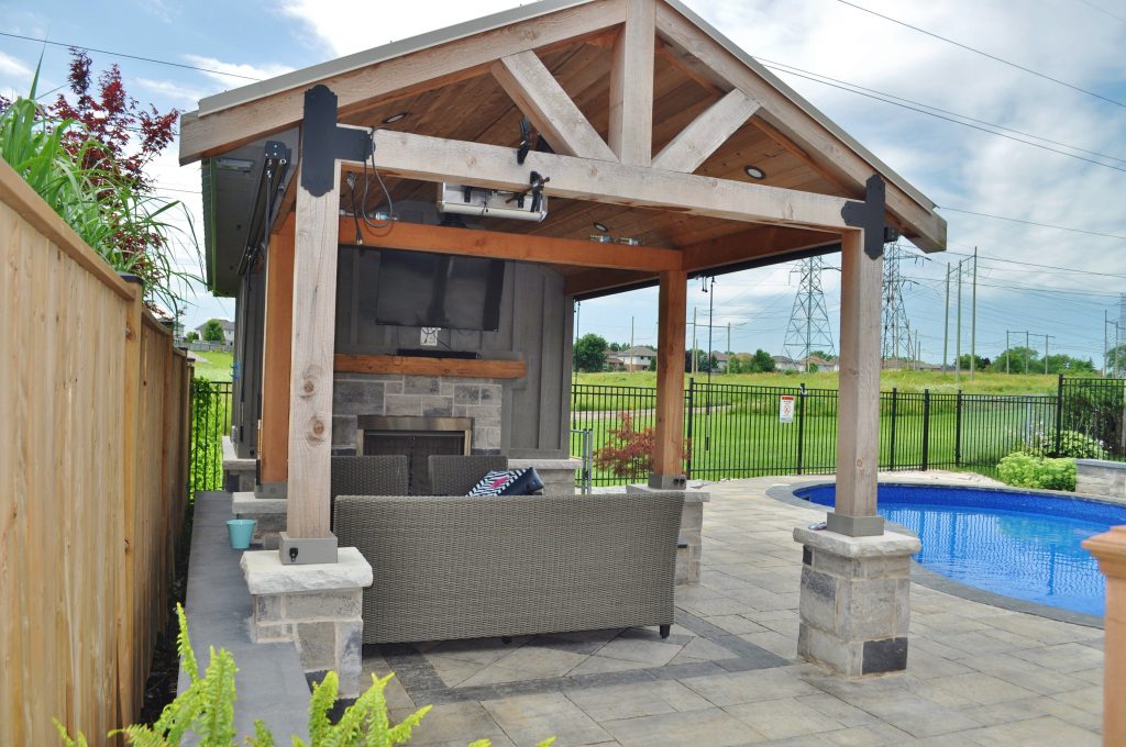 Cozy and functional pool cabana with storage, TV and bar. It doesn't have to be too large to accommodate outdoor furniture.