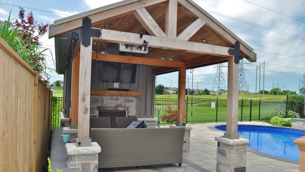 Cozy and functional pool cabana with storage, TV and bar. It doesn't have to be too large to accommodate outdoor furniture.